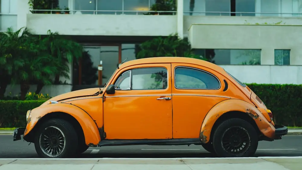 An old car parked kerbside, ready for cash-for-cars removal